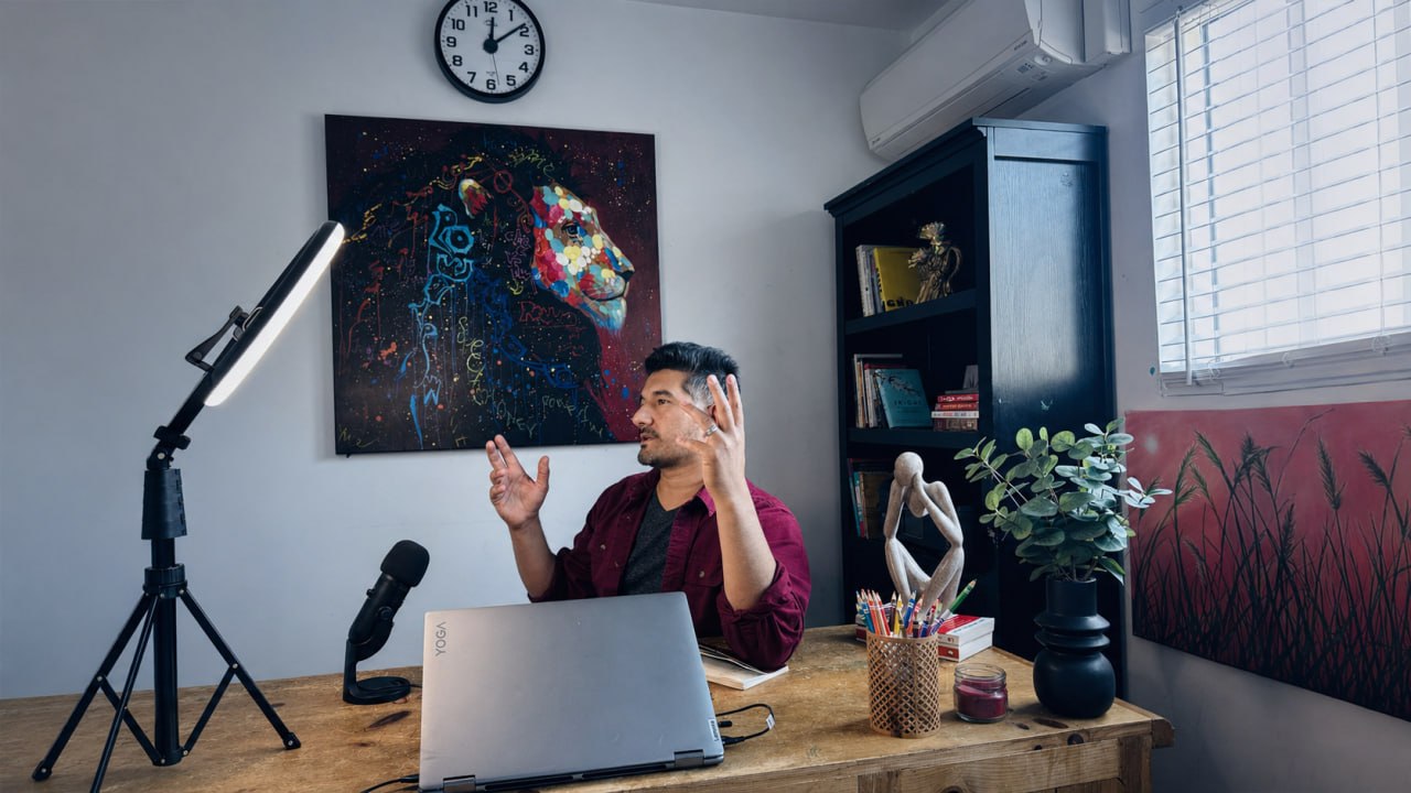Mustafa Sharifi, Founder & CEO of Vornix.ai, mid-sentence at his home office desk