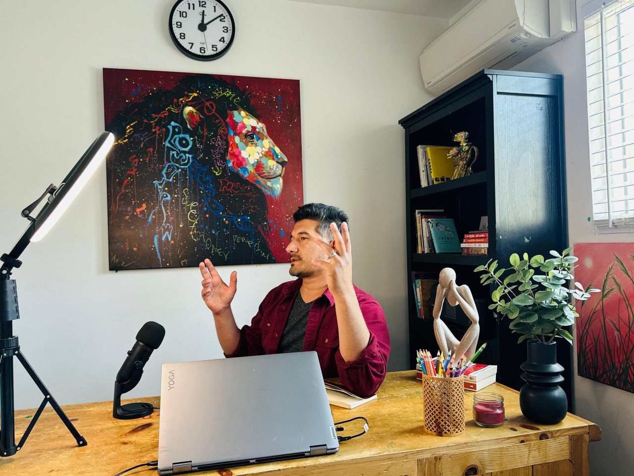 Mustafa Sharifi, founder of Vornix.ai, mid-sentence at his desk.